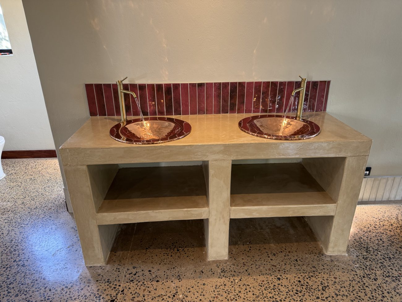 Copper basin vanity with brass taps